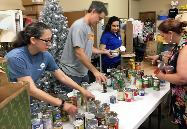 Volunteers help with food drive.